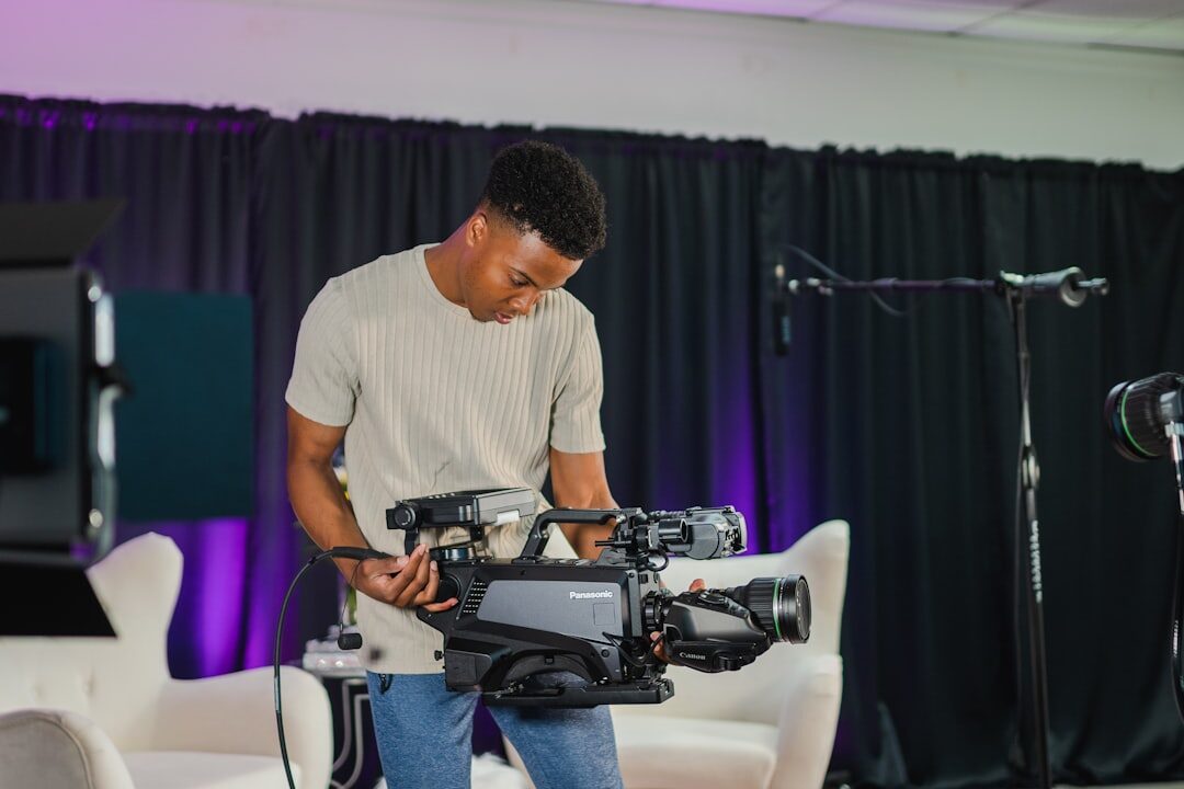 Professional video camera on tripod in a broadcast studio