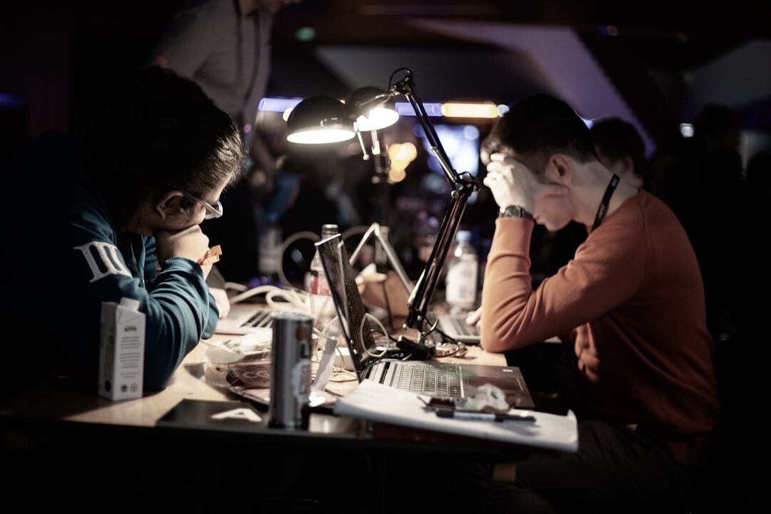Diverse media production team collaborating around monitors in studio